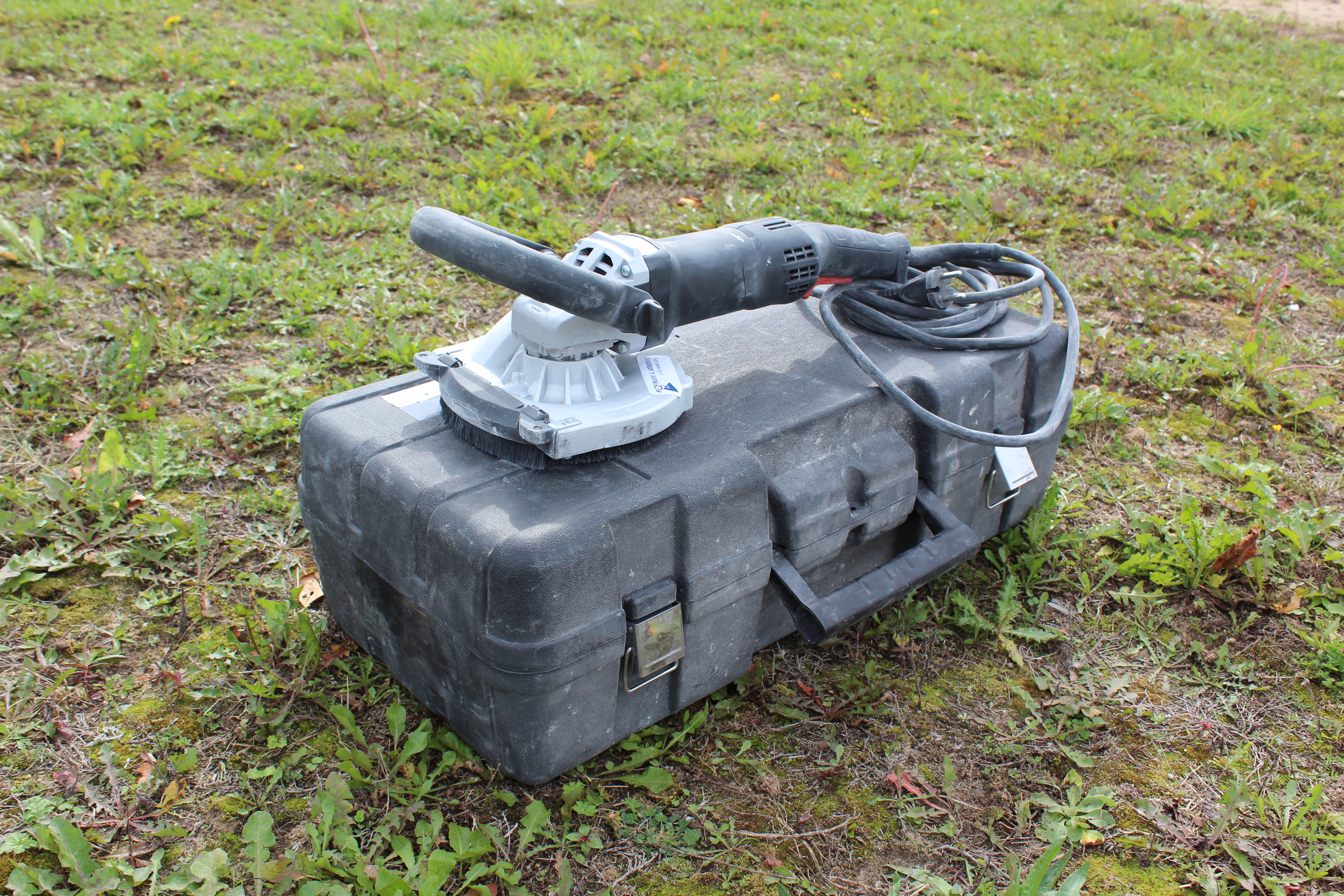Eight shirts arranged on table in black, olive, grey, blue, white, red, mustard, and green.